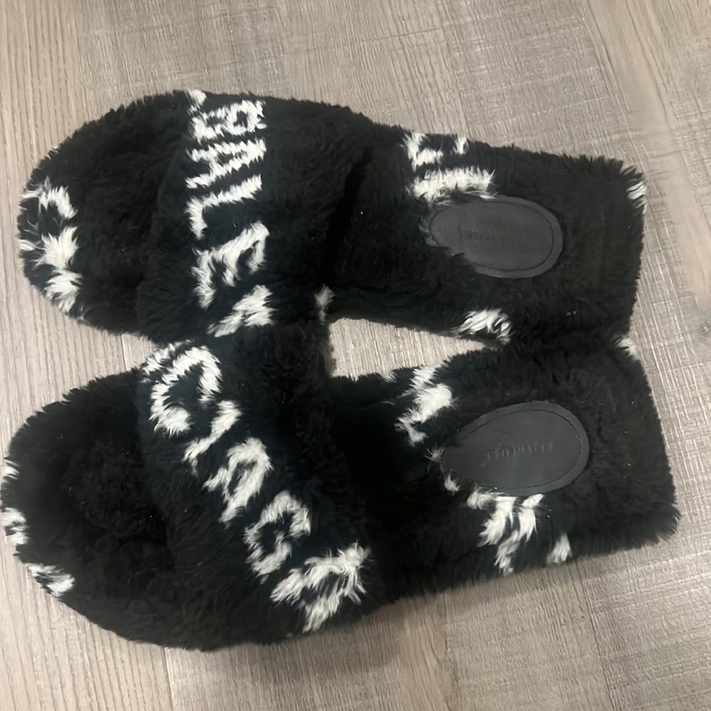 Black and white furry sandals